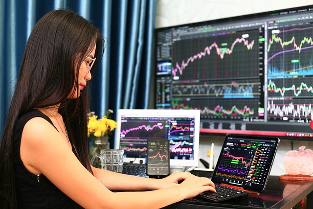 An image showcasing a trader analyzing multiple candlestick charts on a computer screen, surrounded by graphs, indicators, and financial data