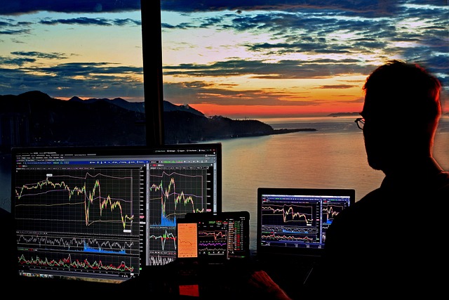An image of a focused trader sitting at a desk, surrounded by motivational quotes and a vision board filled with charts and graphs